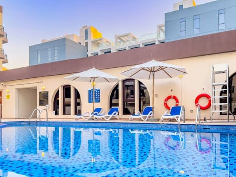 Poolside Retreat: Dive into luxury with sparkling water and sun-soaked lounge chairs!
