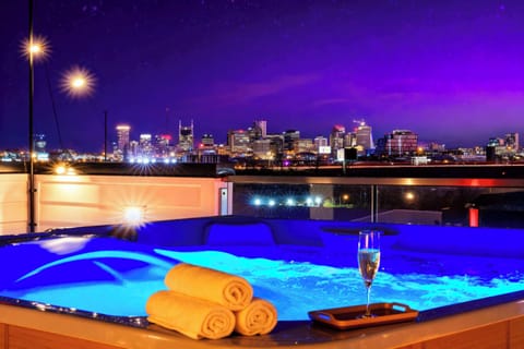 Soak in the stunning skyline views from your private hot tub, the perfect spot for a Nashville getaway with friends or family. Unwind under the stars and indulge in luxury at this chic downtown retreat, where unforgettable memories await!