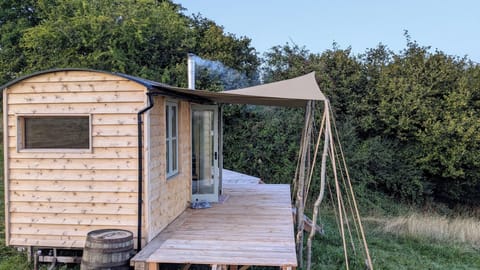 Cwtch Bryn Cabin. Meaning: "Cuddle by the hill".