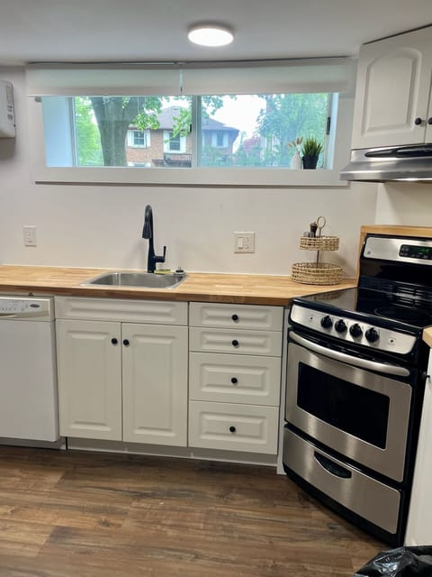 Modern kitchen with stove, microwave, dishwasher, coffee maker, and all the things you need