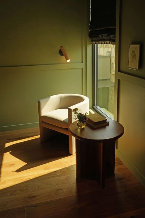 Relax in the sunlit corner with coffee and a good book.