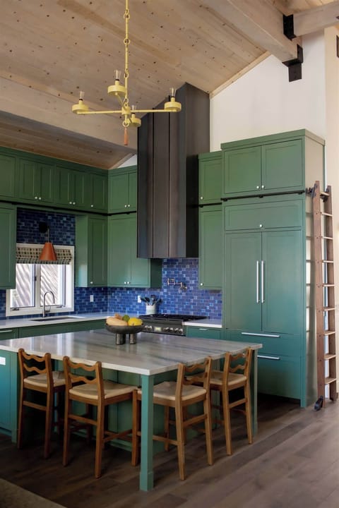 A large center island that seamlessly transforms into a dining space, ideal for casual meals or entertaining guests.