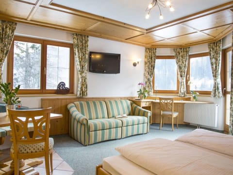 Plant, Furniture, Property, Building, Window, Table, Azure, Comfort, Wood, Houseplant