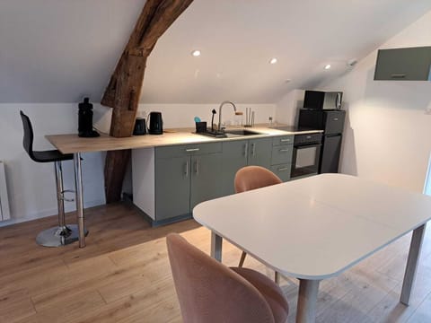 fully-equipped kitchen and dining area - ground floor studio