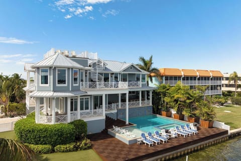 Huge Bayfront home with luxury pool, hot tub, dock just 30 seconds walk to Beach