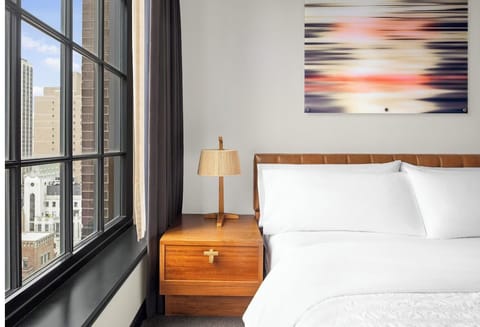 Wake up to skyline views and soft morning light.