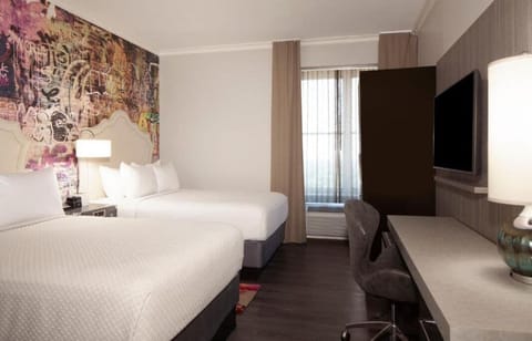 Stretch out in a bright, roomy retreat with two beds.