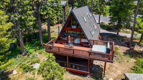 Soak up the sun from the back deck! Enjoy the private hot tub, patio table and BBQ grill. Plus there is a ping pong table underneath the deck.