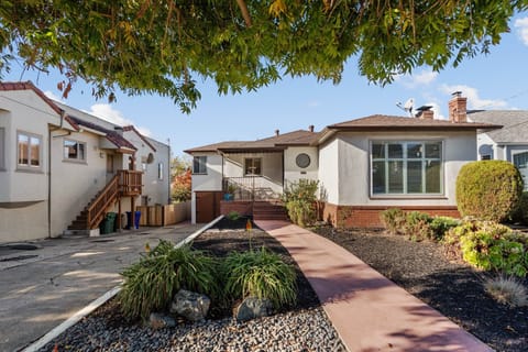 Driveway parks up to 2 cars (tandem), runs along the left side of the front