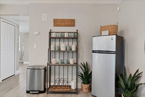 Dining room with additional refrigerator and lanai aceess. Dining table seats 8