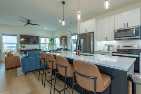 Bar View to Living Room with High Back Bar Stools & Seating for 4