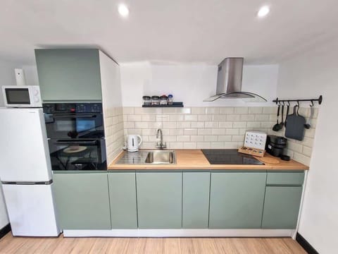 Cook your favorite meals in this fully equipped kitchen, with everything you need to feel at home.