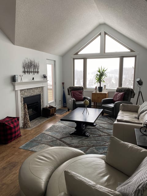 Living area boasts luxurious leather furnishings that combine style and comfort.