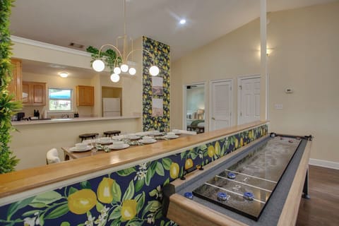 Kitchen, dining area, and shuffleboard in the living room