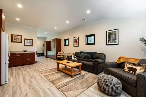 The 4th Bed & Bath is set up as a private suite on the first floor. Bed, Bath, Kitchenette, living area, and patio.