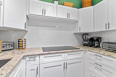 The kitchen coffee center and induction range.