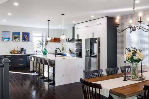 Entertain with ease in the open kitchen with waterfall island & designer lighting