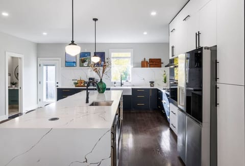 Kitchen with oversized island, premium appliances & seating for groups