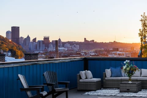 Rooftop deck with lounge seating & sweeping Pittsburgh skyline views