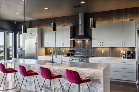 Kitchen 1: Cook with a view! This modern kitchen offers stunning cityscapes while you create sumptuous meals.
