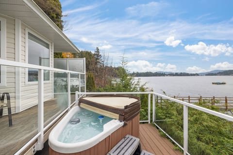Relax and soak in the hot tub while listening to the waves along the shore.