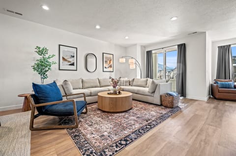 Lovely living room with modern decor and lovely mountain views.