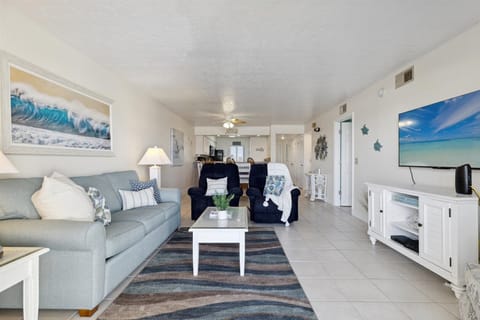 Relaxing living area with plush seating and ocean-inspired decor.