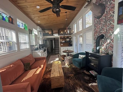 Butterfly Creek Cottage: The living room and kitchen offer an open-concept layout with a view of the loft, perfect for cooking, relaxing, and keeping everyone connected.