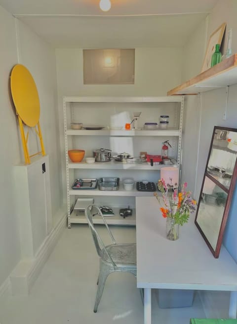 Pantry with long table, light pouring in.