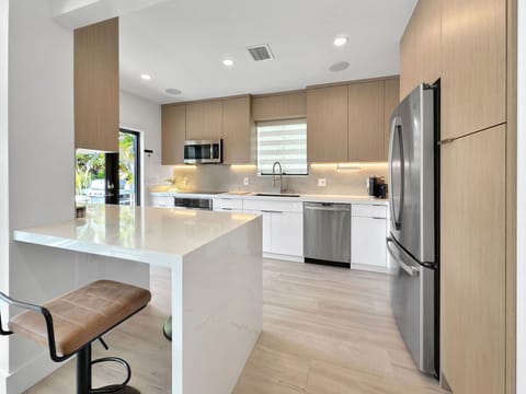 Modern kitchen + counter seating  for two.  