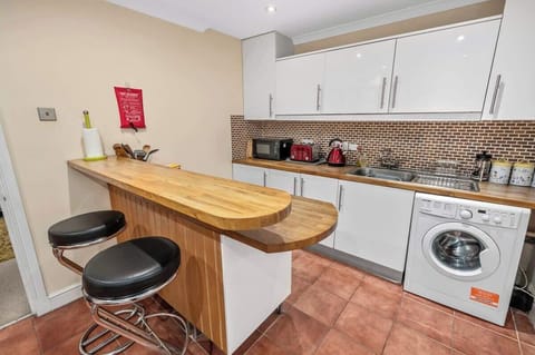 Modern kitchen stocked with everything needed to enjoy a home-cooked meal