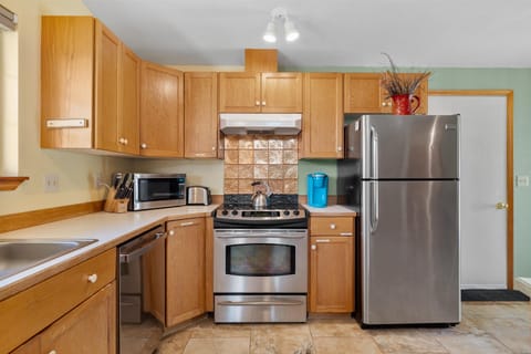 The open, breezy kitchen offers ample space & all the comforts of home