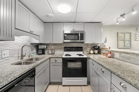 Bright, fully equipped kitchen with granite counters and plenty of space for easy vacation meals