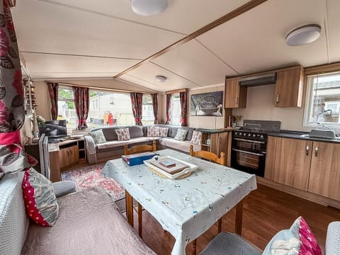 With comfortable seating and a functional kitchen, you can prepare meals while still connecting with others in the living room.