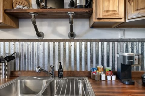 Studio kitchenette with assorted choices of coffee, teas and snacks.