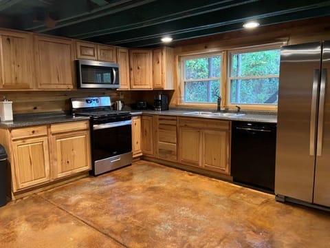 Extra Large kitchen with new deluxe appliances is stocked to prepare any meal.