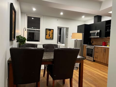  The open-concept kitchen and dining area invite connection and conversation.