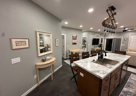 Island with seating and additional dining table and chairs.