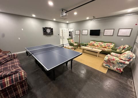 Dart board and ping pong table.