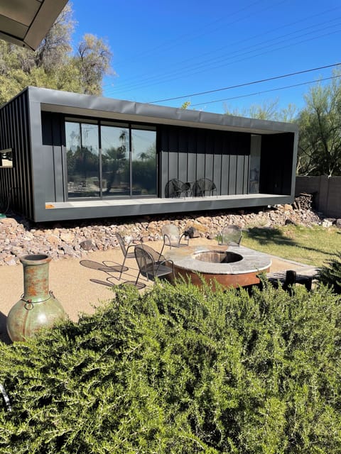 View of front of guest house, set over the wash and fire pit in back yard