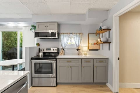 Prepare your favorite meals in this inviting kitchen, where space and style make cooking feel effortless.