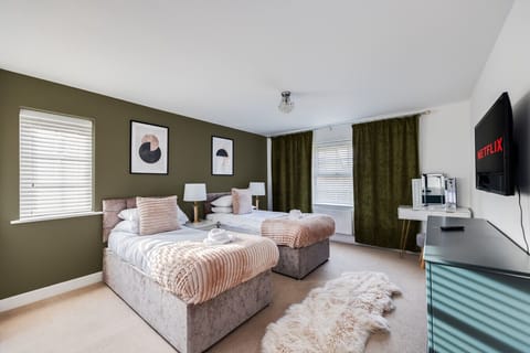 Bedroom 1: Zip Link Bed (set up as two single beds by default or can be zipped as a king size bed upon request)