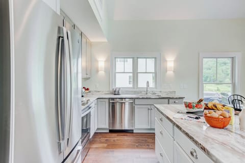 Modern kitchen with stainless appliances and granite countertops