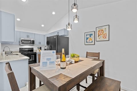 2. Dining room fits 6 people. Back view of the kitchen