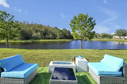 Wake up to peace and nature — a tranquil backyard with breathtaking lake views.
