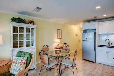 Open concept kitchen area with dining table and breakfast bar