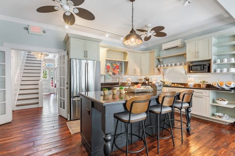 Kitchen on main level opens up to the pool area
