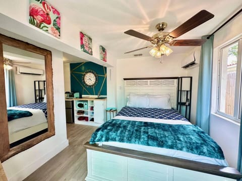 Relax in this vibrant and cheerful bedroom, featuring lively décor and a cozy atmosphere that adds a fun and inviting touch to your stay.