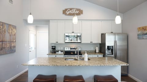 Bar seating and a fully equipped kitchen to satisfy all your cooking needs.