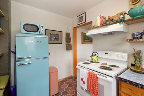 Vintage style refrigerator and microwave.